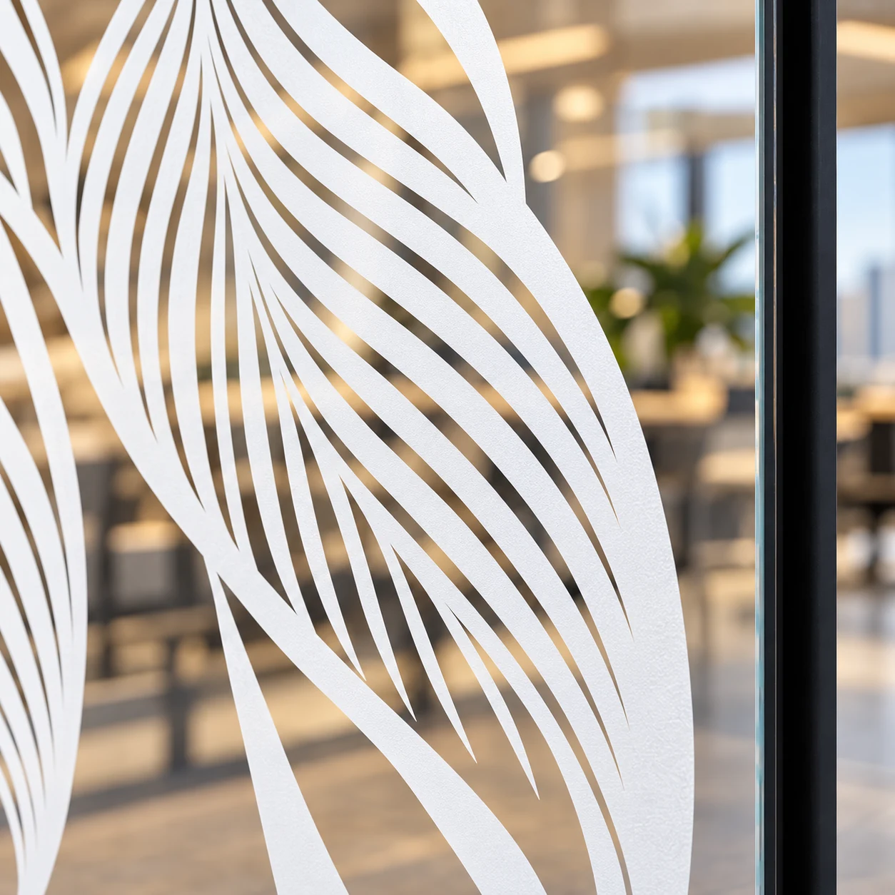 Close-up of fine white leaf lines printed on window film with clear gaps